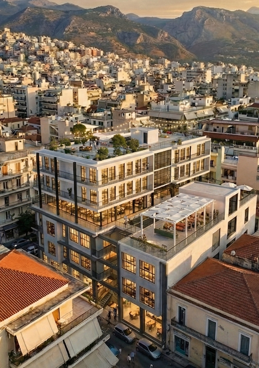 The HUB Student Apartments, Patras — aerial view at dusk with rooftop terrace